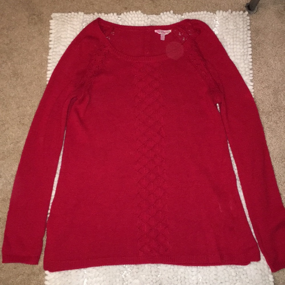 Candie’s red sweater